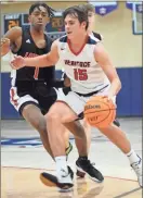  ?? Michelle Petteys, Heritage Snapshots ?? Heritage’s Collin Swaeringin tries to get past LFO’S Dee Calhoun during Saturday night’s battle in Boynton. The Generals used a big fourth quarter to rally for a 62-57 win, avenging a loss at LFO the week before.