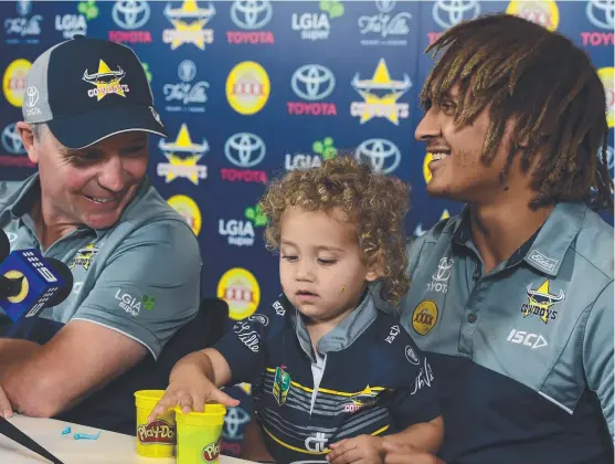  ?? PLAY TIME: Retired Cowboys player Ray Thompson with daughter Ivy, 2, and North Queensland coach Paul Green. Picture: EVAN MORGAN ??