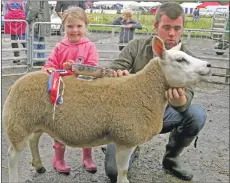  ?? Picture by Kevin McGlynn. ?? Overall cross sheep champion from Elliot Bowman, Port Ellen in Islay, with his Texel ewe pictured with his niece Olivia.