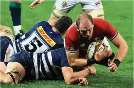  ?? Picture: David Rogers/Getty ?? British & Irish Lions forward Alun Wyn Jones is tackled by a Stormers player during Saturday’s game in Cape Town, South Africa