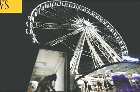  ?? BERNADETT SZABO / REUTERS ?? Chefs prepare food as Michelin-starred restaurant Costes serves diners on the Budapest Eye ferris wheel. Costes owner Karoly Gerendai said the downturn in customers due to the pandemic has forced him to look for new ways to do business.