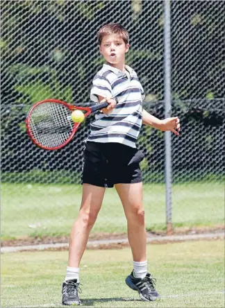  ?? Photo: DEREK FLYNN/FAIRFAX NZ ?? Take that: Aiden Neal belts a forehand return during the Rapaura Tennis Club’s annual junior doubles tournament on Saturday.