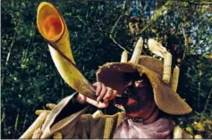  ?? ?? A member of the carnival group La Vijanera de Silio blows a horn during the festival.