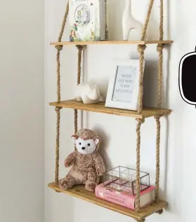  ??  ?? Instead of L brackets, use rope to hang a few shelves for a fun and charming twiston wall shelves.