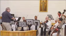  ?? Associated Press ?? String instrument­alists perform “Hava Nagila,” an Israeli folk song at the Utah State Prison. The director of the famed Mormon Tabernacle Choir helped train at the Utah State Prison in preparatio­n for a recent spring recital.