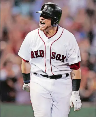  ?? CHARLES KRUPA/AP PHOTO ?? Christian Vazquez celebrates as he rounds first after hitting a game-winning three-run homer in the bottom of the ninth inning to rally the Red Sox to a 12-10 win over the Cleveland Indians on Tuesday night at Fenway Park. the win allowed Boston to...