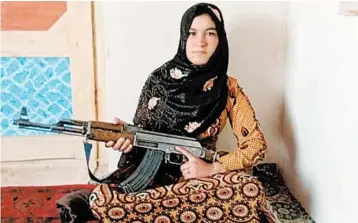  ?? GHOR DISTRICT GOVERNMENT ?? Qamar Gul fought off Taliban attackers who killed her parents. Her story reveals the complicate­d crosscurre­nts of the war.