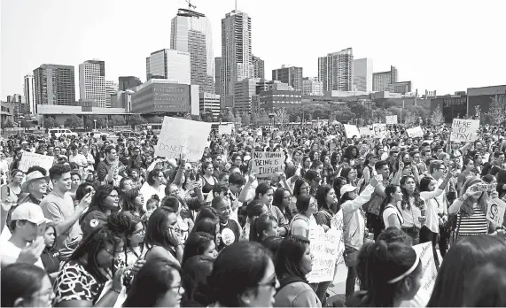  ?? Joe Amon, Denver Post file ?? Students, immigrants and affected individual­s march onthe Auraria campus in downtown Denver to defend the Deferred Action for Childhood Arrivals program during a citywide walkout and rally in 2017.