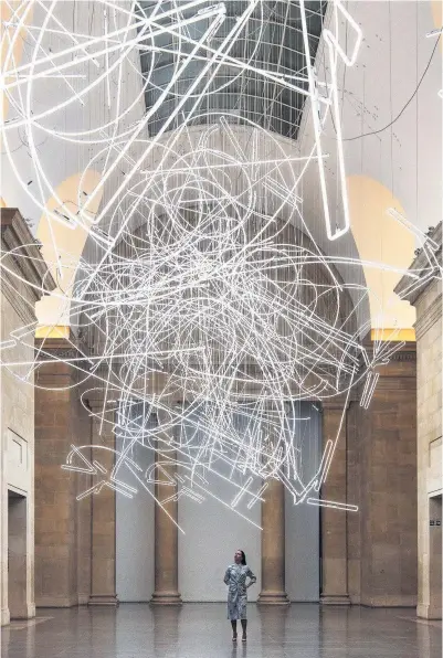  ??  ?? > The unveiling of the Tate Britain Commission 2017 by Welsh conceptual sculptor Cerith Wyn Evans entited Forms in Space... By Light (in Time)