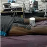  ?? REUTERS & TWITTER ?? Multiple Olympic champion Usain Bolt grimaces in pain after tearing his hamstring, above, and receiving treatment for the injury in Jamaica, below.