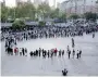  ??  ?? Residents lining up to be tested for the COVID-19 coronaviru­s, as part of a mass testing program in Qingdao (AFP)