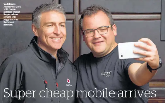  ??  ?? Vodafone’s Jason Paris (left), with Kogan Mobile’s Ruslan Kogan, whose service will piggy-back on the telco’s network.