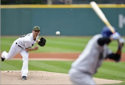  ?? DAVID DERMER — THE ASSOCIATED PRESS ?? Indians starting pitcher Josh Tomlin delivers to the Royals’ Alcides Escobar in the first inning May 28 at Progressiv­e Field.