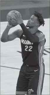  ?? Mike Stobe / Getty Images /TNS ?? Jimmy Butler #22 of the Miami Heat in action against the Newyork Knicks at Madison Square Garden on March 29 in Newyork City.