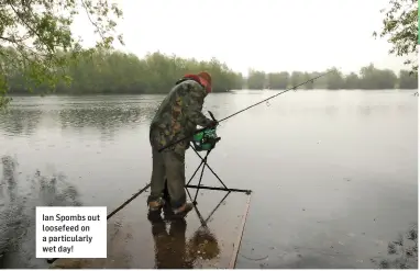  ??  ?? Ian Spombs out loosefeed on a particular­ly wet day!