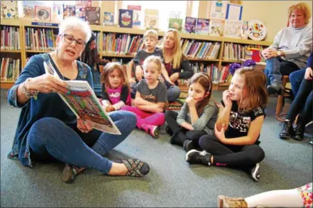  ?? LISA MITCHELL - DIGITAL FIRST MEDIA ?? Fleetwood Mayor Tammy Gore reads to youth at Fleetwood Public Library’s Girl Power Story Hour March 10.