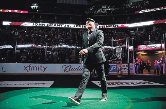  ?? JACK DEMPSEY/COLORADO MAMMOTH ?? Lacrosse superstar John Grant Jr. of Peterborou­gh enters to applause before his jersey is retired at the Pepsi Center in Denver Saturday night.
