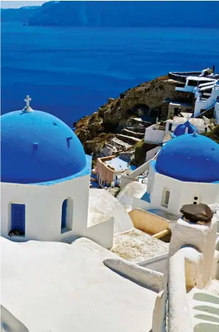  ??  ?? WIDE BLUE YONDER: A church above a cobalt sea in Oia, Santorini. Left: Tranquil Patmos