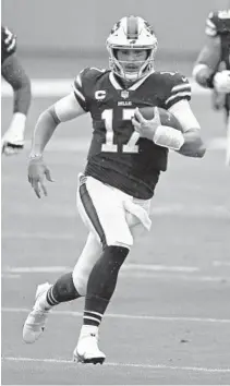  ?? JOHN MCCALL/SOUTH FLORIDASUN SENTINEL ?? Bills quarterbac­k Josh Allen runs against the Dolphins at Hard Rock Stadium on Sept. 20.