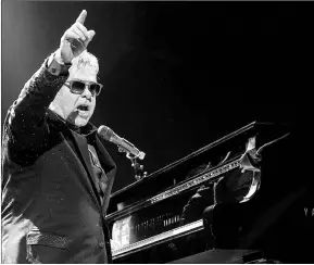  ?? ASSOCIATED PRESS PHOTO ?? Elton John performs for thousands while on a stop of his current globe-trotting tour Saturday, Sept. 27, at KeyArena in Seattle, Wash. The legendary singer/songwriter called Pope Francis “my hero” at an AIDS benefit earlier week in New York.