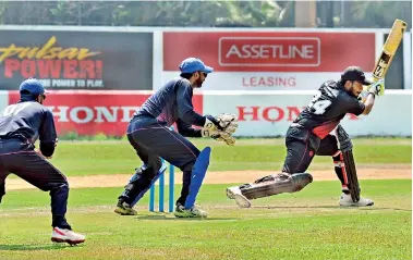  ??  ?? Thusith Silva of Pan Asia drives through the covers - Pix by Ranjith Perera