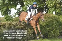  ??  ?? Brazilian rider Carlos Parro triumphs aboard Goliath III to win an intermedia­te by a comfortabl­e margin