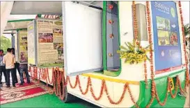  ?? ASHOK DUTTA/ HT PHOTOS ?? (Above) The state biodiversi­ty board’s ‘Prakriti’ mobile bus-cum-exhibition aims to spread awareness on ecological and conservati­on issues and (below) minister of state Abhishek Misra inaugurate­s the bus, surrounded by top administra­tive officials.