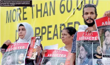  ??  ?? An Amnesty internatio­nal organised protest for missing people takes place in Colombo (AFP)