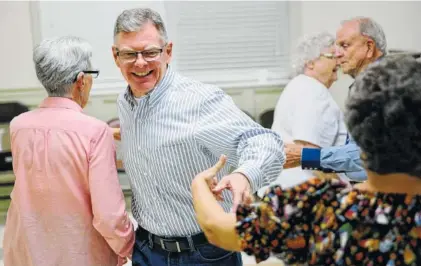  ?? STAFF PHOTO BY ERIN O. SMITH ?? Jerome Gordon, who went through bariatric surgery 11 months ago, participat­es in a square dancing group last week at East Ridge Presbyteri­an Church in East Ridge. Gordon said before he underwent the surgery, he was unable to do many things he loved,...