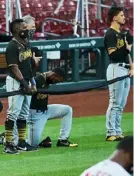  ?? Scott Kane/Getty Images ?? Jarrod Dyson took a knee during the national anthem prior to the Pirates first game Friday.