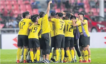  ??  ?? Malaysia players celebrate after reaching the 2018 Suzuki Cup final.