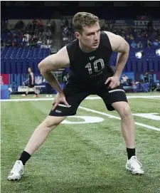  ?? Ap file ?? GETTING HIS NAME OUT THERE: Brown quarterbac­k E.J. Perry warms up at the scouting combine in Indianapol­is on March 3.