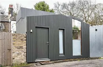  ?? ?? Hut property: The ultra-modern flat in Hackney, east London, has an open-plan kitchen/living room and tiny upstairs bedroom