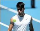  ?? Picture: GRAHAM DENHOLM/ GETTY IMAGES ?? TRAINING HARD: Carlos Alcaraz of Spain prepares for the Australian Open with a training session at Melbourne Park