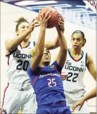  ?? David Butler II / Associated Press ?? UMass Lowell forward Denise Solis (25) grabs a rebound against UConn forward Olivia Nelson-Ododa (20) during the second half of an NCAA women’s basketball game on Saturday in Storrs.