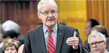  ?? SEAN KILPATRICK/THE CANADIAN PRESS ?? Minister of Transport Marc Garneau stands during question period in the house of commons on Parliament Hill in Ottawa on Thursday. Garneau will join Quebec Internatio­nal Relations Minister Christine St-Pierre as part of a delegation heading to Paris in the coming days to meet with European officials to plead their case for keeping the World Anti-Doping Agency headquarte­rs in Montreal.
