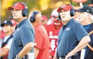  ?? ANDRES LEIGHTON AP ?? New Mexico head coach Danny Gonzales (left) played for Rocky Long (right) at New Mexico. When Gonzales was hired by UNM, he brought Long back as his defensive coordinato­r.