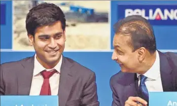  ?? PTI ?? Reliance Capital chairman Anil Ambani (right) with son Anmol at the company’s AGM in Mumbai on Tuesday. “Anmol has brought tremendous luck. The (Rel Cap) stock price has risen 40% since his induction into the board,” Ambani said. He said Reliance...