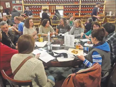  ?? Emily M. Olson / Hearst Connecticu­t Media ?? Guests at a forum hosted by the Mad River Market co-op Tuesday night in Winsted.