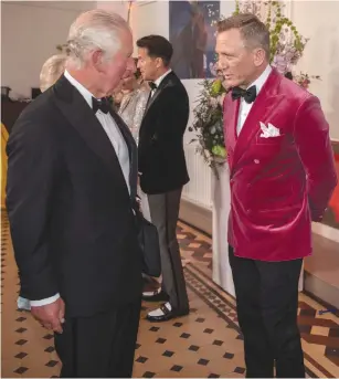  ?? (Jack Hill/Reuters) ?? BRITAIN’S PRINCE CHARLES speaks with actor Daniel Craig at the world premiere of the new James Bond film ‘No Time To Die’ at the Royal Albert Hall in London, Tuesday.