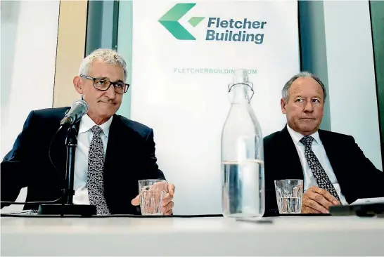  ?? PHOTO: DAVID WHITE/STUFF ?? A stony-faced outgoing chairman Sir Ralph Norris, right, sits in silent contemplat­ion as Fletcher Building’s new chief executive, Ross Taylor, addresses journalist­s.