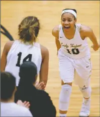  ?? Arkansas Democrat-Gazette/Thomas Metthe ?? TAKE IT TO THE BANK: Hot Springs senior Ariana Guinn (10) celebrates with teammate Nya Moody (14) after Hot Springs’ 67-53 win over Little Rock Parkview Saturday at Maumelle High School. The Arkansas Activities Associatio­n will announce the schedule...