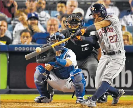  ?? ASSOCIATED PRESS FILE PHOTO ?? The Houston Astros’ Jose Altuve hits a home run against the Los Angeles Dodgers during the 10th inning of Game 2 of the World Series in Los Angeles on Oct. 25. Altuve was named The Associated Press Male Athlete of the Year on Wednesday.