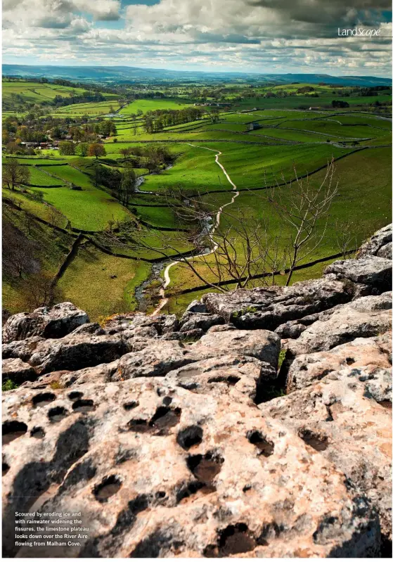  ??  ?? Scoured by eroding ice and with rainwater widening the fissures, the limestone plateau looks down over the River Aire flowing from Malham Cove.