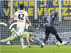  ?? AFP ?? Inter Milan’s Romelu Lukaku, right, shoots to open the scoring against Atalanta.