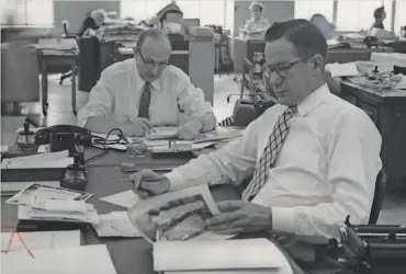  ?? MILWAUKEE JOURNAL ?? Green Sheet Editor Larry Lawrence (left) and Assistant Editor Wade Mosby, shown in this 1954 photo, spend nights thinking up those top-line Green Sheet gags.