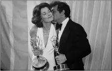  ?? THE ASSOCIATED PRESS ?? Peter Falk of “Columbo” gives Jessica Walter of “Amy Prentice” a kiss after both won Emmys on May 19, 1975. Walter won for best actress in a limited series while Falk was named best actor in a lined series. Walter’s death was confirmed March 25 by her daughter, Brooke Bowman. The actor’s best-known film roles included playing the stalker