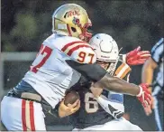  ?? / Cecil Copeland, MDJ ?? Rome’s Rayquan Jones (97) tackles Kell quarterbac­k Evan Conley during a Region 7-5A game at Kell on Friday. Rome won 35-6.