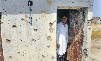  ?? HT PHOTO ?? Pockmarks on the wall of a house after crossborde­r firing in RS Pura.