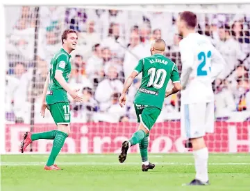  ??  ?? Leganes’ Spanish midfielder Javier Eraso (L) celebrates a goal during the Spanish ‘Copa del Rey’ (King’s cup) quarter-final second leg football match between Real Madrid CF and CD Leganes at the Santiago Bernabeu stadium in Madrid. - AFP photo